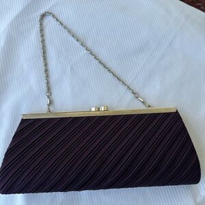 Pleated satin evening bag. Color is plum.